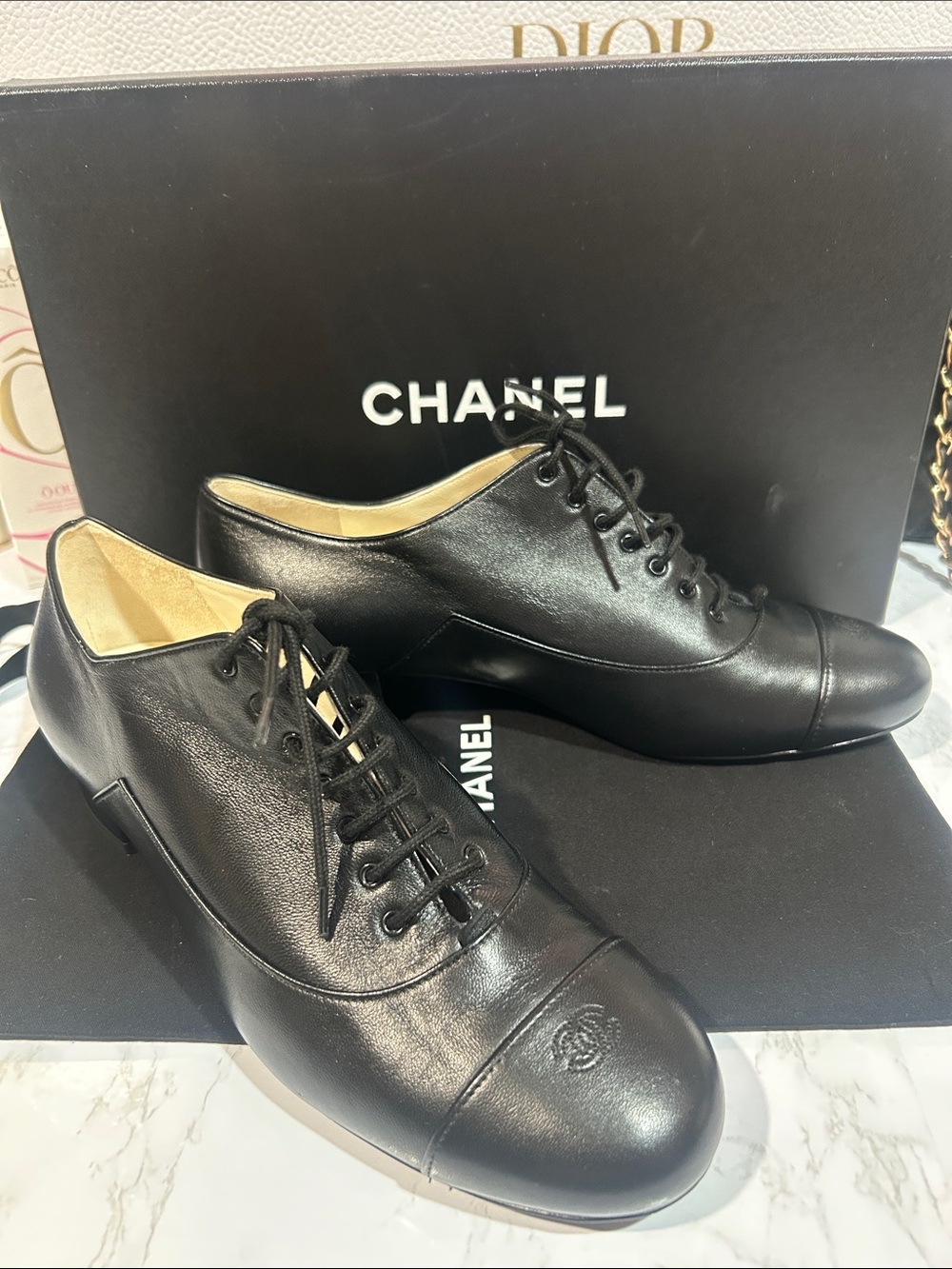 CHANEL Black Leather Lace-Up Oxfords with Embossed CC Cap Toe